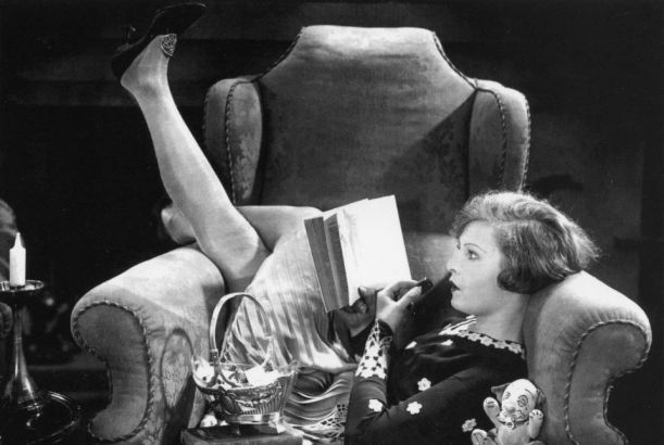 woman reading in chair